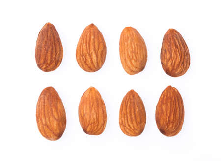 Almonds isolated on white backgroundの写真素材