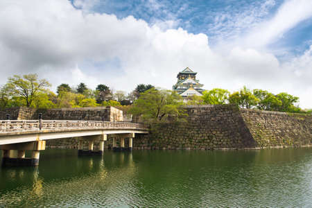 Osaka Castle with dramatic cloudy skies in Osaka, Japan.のeditorial素材