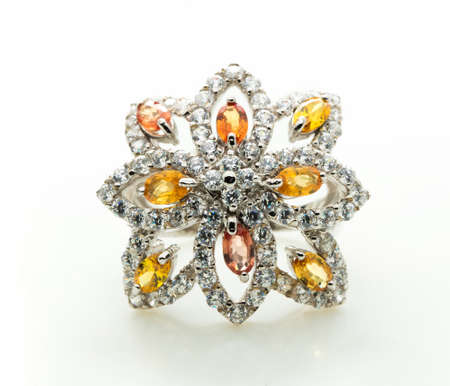 classic ring with a yellow topaz stone on white backgroundの写真素材