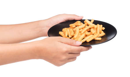 hand holding a dish of snacks isolated on a white backgroundの写真素材