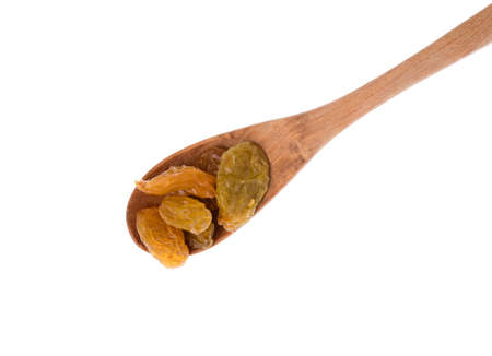 spoon of Raisins isolated on white backgroundの写真素材