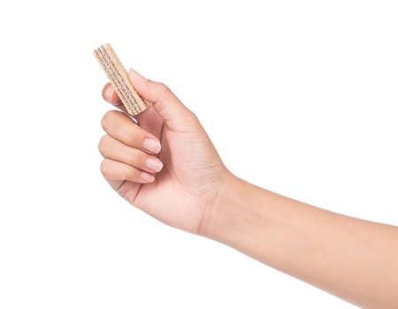 hand holding chocolate waffles isolated on white backgroundの写真素材