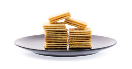 dish of Tasty biscuits isolated on white backgroundの写真素材