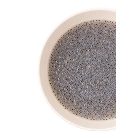 Sweet basil seed on bowl isolated on white background.の写真素材