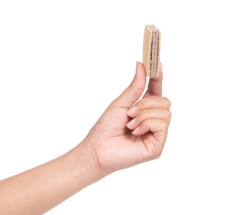 hand holding chocolate waffles isolated on white backgroundの写真素材
