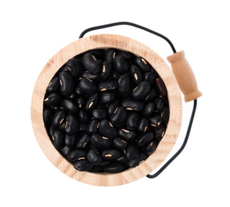 Wooden cask of black bean isolated on white backgroundの写真素材
