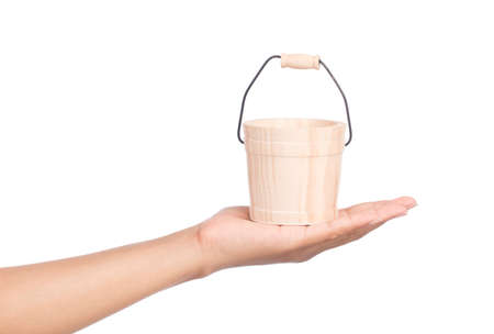 hand holding small wood keg isolated on a white backgroundの写真素材