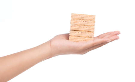 hand holding strawberry waffles isolated on white backgroundの写真素材