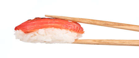 Tuna sushi nigiri in chopsticks isolated on white backgroundの写真素材