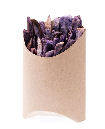 fried taro snacks in brown bag paper isolated on white backgroundの写真素材