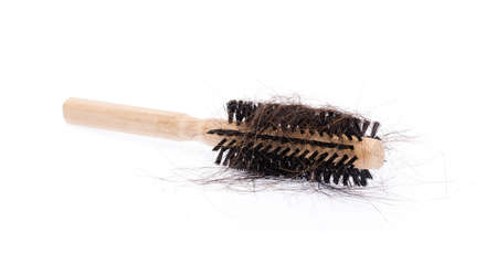 comb brush with lost hair, isolated on white backgroundの写真素材