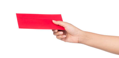 hand holding Red envelope to give in chinese new year day isolated on white backgroundの写真素材