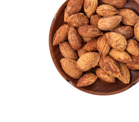 dish of almonds isolated on white background