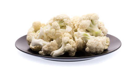 Pile of Cauliflower on plate isolated on white backgroundの写真素材