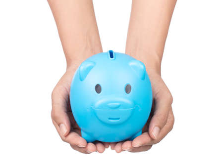 hand holding Blue of piggy bank isolated on white backgroundの写真素材