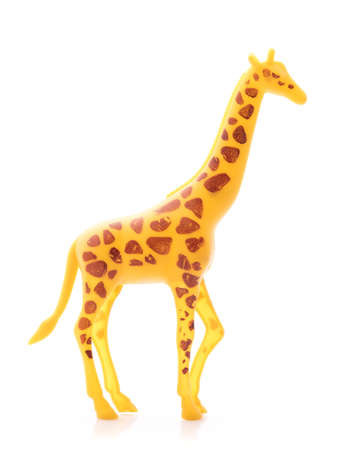 giraffe made out of plastic. animal toy isolated on white backgroundの写真素材