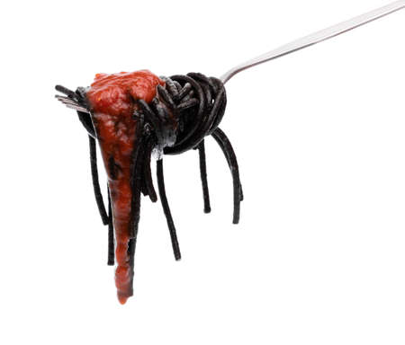fork of Black spaghetti in sauce isolated on white backgroundの写真素材