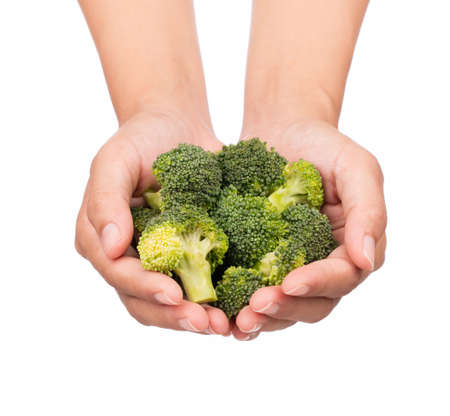hand holding Broccoli isolated on white background