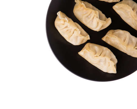wontons on dish isolated on white background.の写真素材