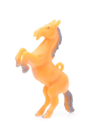 Toy horse made of plastic isolated on white backgroundの写真素材