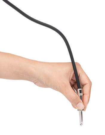 hand holding Audio jack connection of microphone isolated on white background.