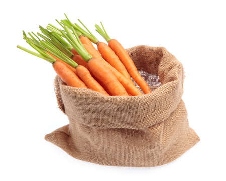 fresh baby carrot in sack  isolated on white background.の写真素材