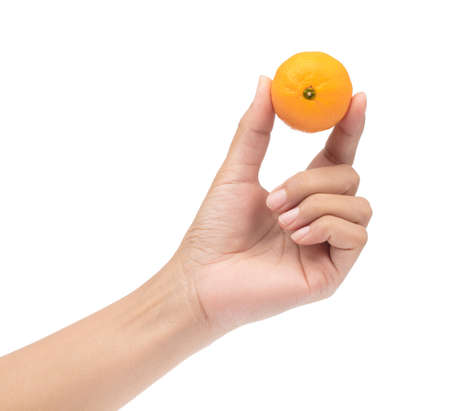 hand holding orange isolated on white backgroundの写真素材