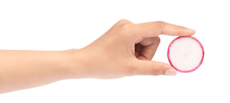 hand holding slice red radish isolated on white backgroundの写真素材