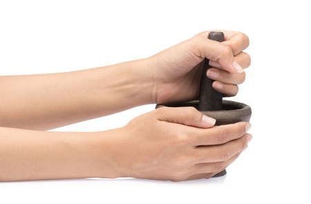 Mortar in a female hand isolated on white background