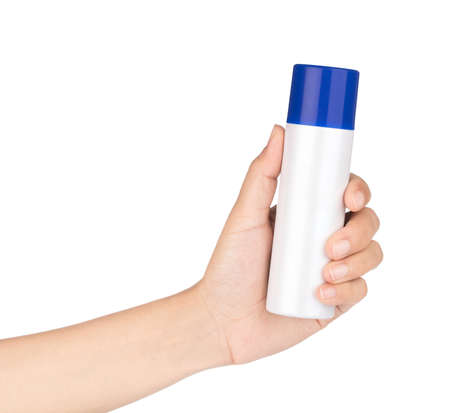 Sunscreen protection can in a female hand, isolated on white background.の写真素材