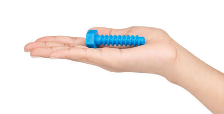 hand holding plastic bolt or nut isolated on white background