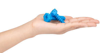 hand holding plastic bolts or nuts isolated on white background