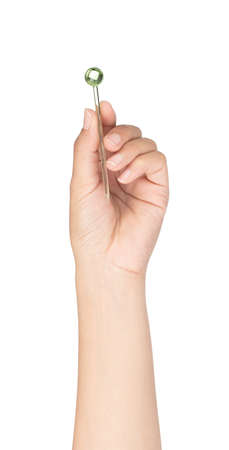 hand holding stick canape isolated on white backgroundの写真素材