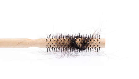 comb brush with lost hair, isolated on white background