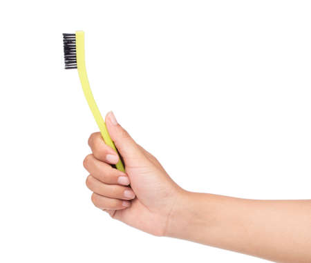 hand holding washing brushes isolated on white background.の写真素材