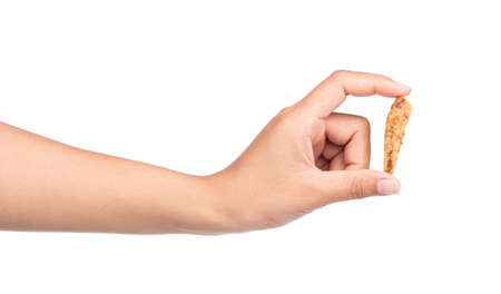 hand holding snacks fried fish isolated on white backgroundの写真素材