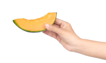 hand holding Sliced Cantaloupe melon Isolated on White Backgroundの写真素材