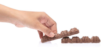 hand holding a Chocolate Bar isolated on white background.