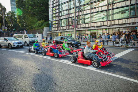 Tokyo, JAPAN - October 16, 2016: Street kart tour, Mario kart tour is tourists dress up in superhero character costumeのeditorial素材