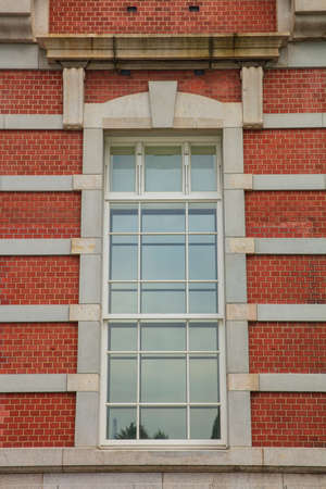 Window with a red brick wall