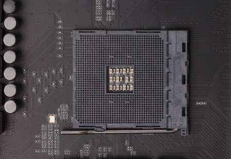 Thermal compound on cpu chip in mainboard computer isolated on white background