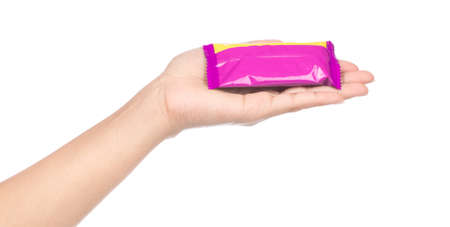 hand holding snack crisp packet isolated on white background