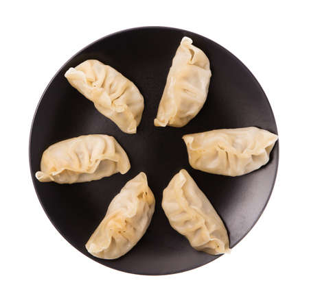 wontons on dish isolated on white background.の写真素材