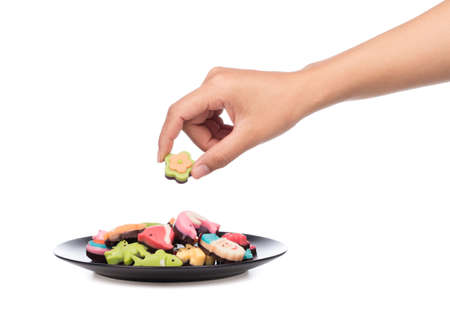 hand holding dish of Chocolate Fancy cute isolated on white background.