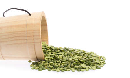 Wooden cask of green Split bean isolated on white backgroundの写真素材