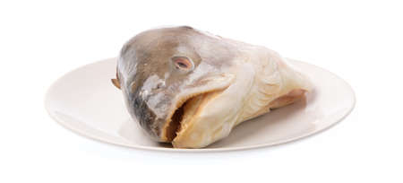 plate of salmon head isolated on white background