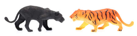 toy plastic tigers isolated on white background