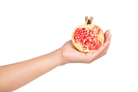 hand holding Pomegranates Fruit isolated on a white background.の写真素材