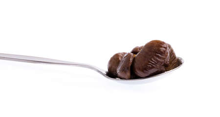 spoon of chestnuts isolated on white backgroundの写真素材