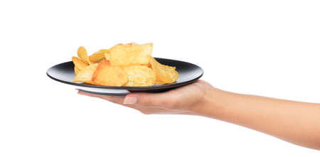 hand holding Potato chips on dish isolated on white backgroundの写真素材